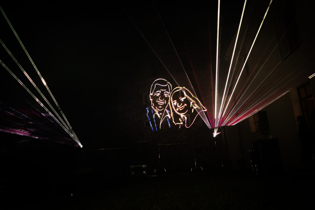 Laser show at wedding, portrait of bridal couple