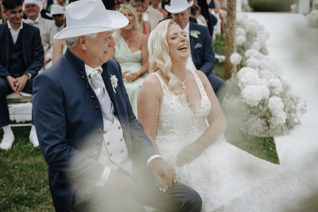 Bridal couple laughing during ceremony at Ellwangen Palace