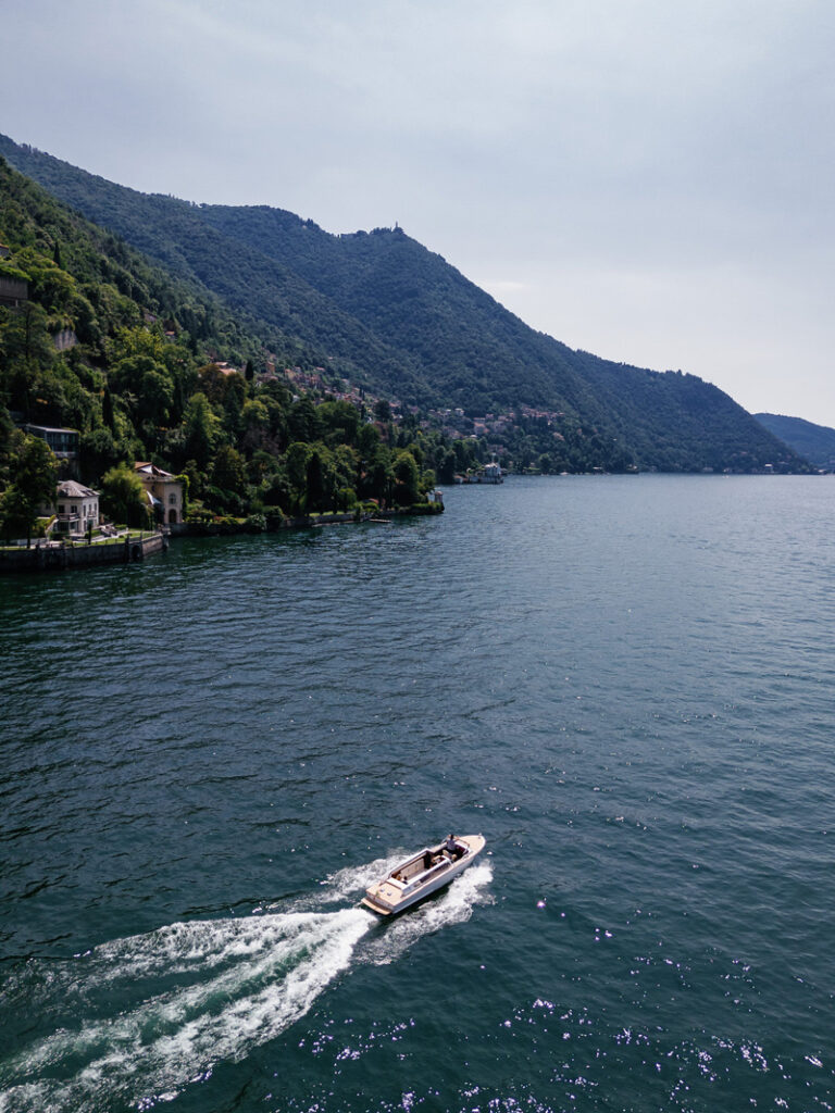 Boat on Lake Como with Mountains in Background